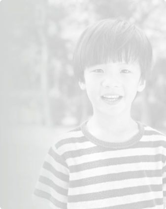 Smiling young boy in striped shirt