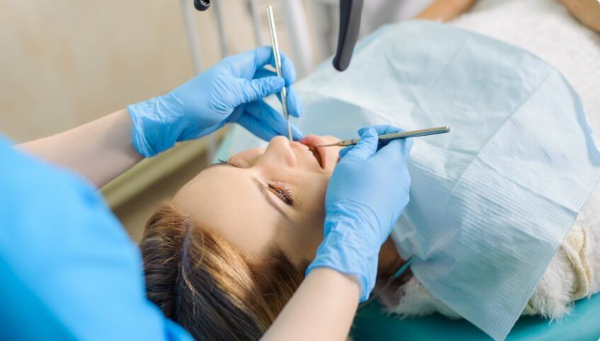 Dentist examining a patient before root canal treatment in Yarmouth