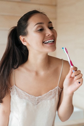 Woman brushing her teeth